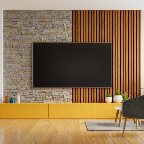 Smart TV on the white wall in living room with armchair and sofa,minimal design